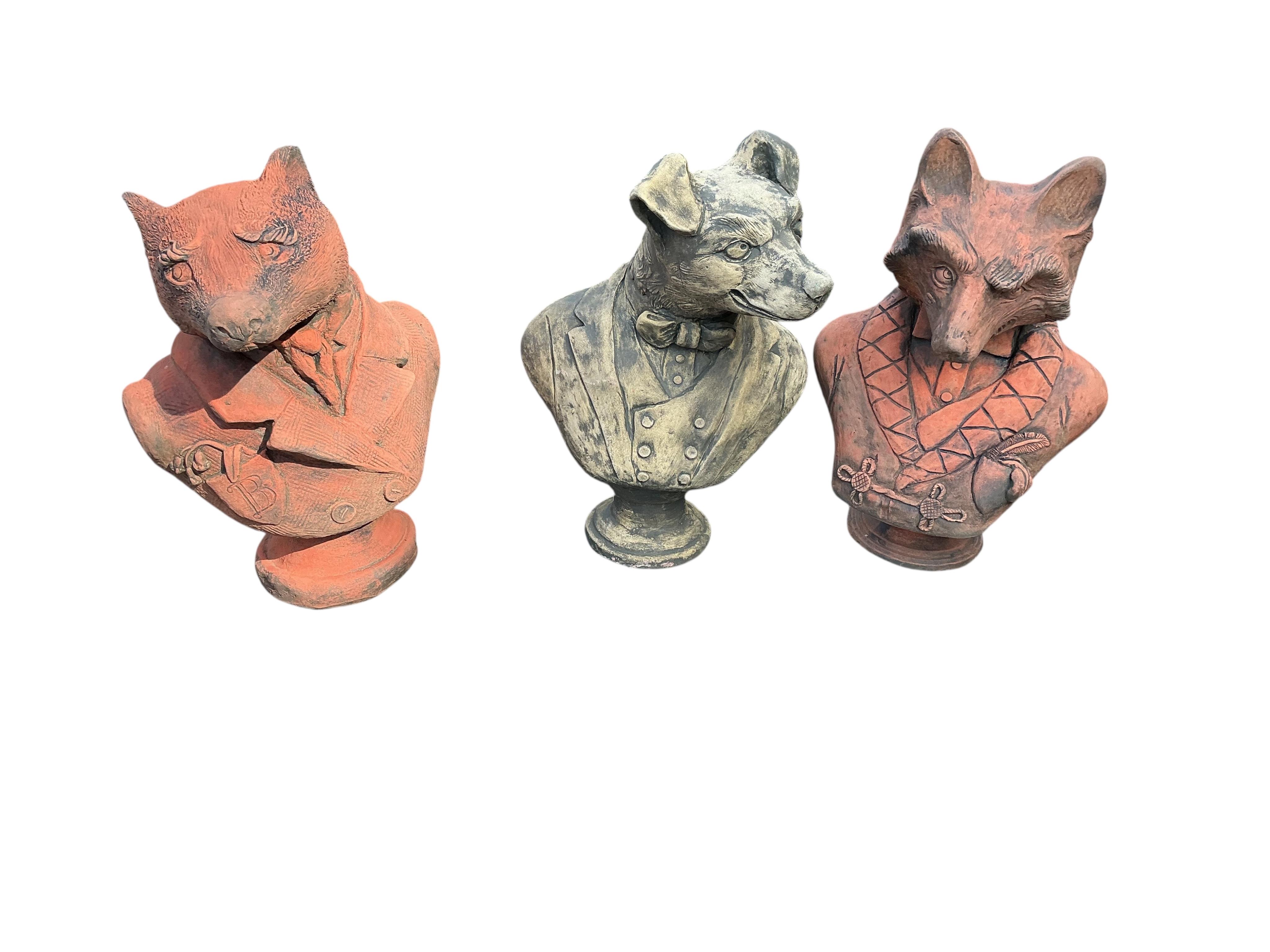 Three cast stone fox, badger and hound busts, largest height 41cm